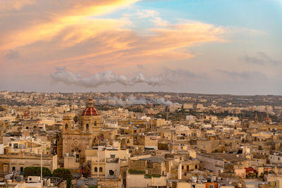 High angle view of townscape against sky at sunset