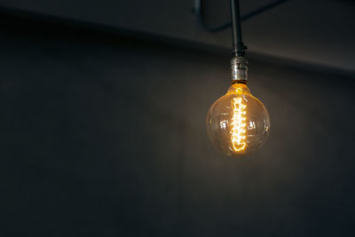 Close-up of illuminated light bulb