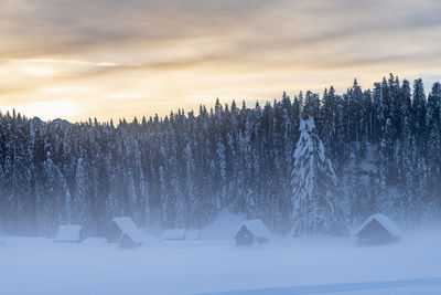 Scenic view of snow covered mountains against sky