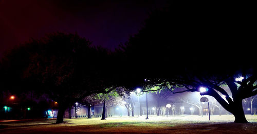 View of illuminated street at night