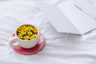 High angle view of yellow and knife on table