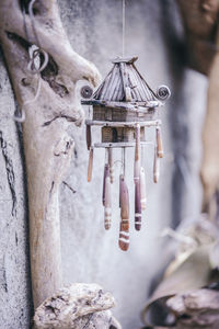 Close-up of decoration handing against wall outdoors