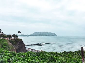 Scenic view of bay against sky