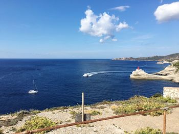 Scenic view of sea against blue sky