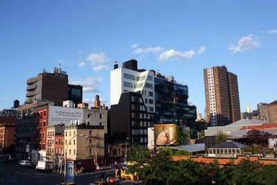 Buildings in city against sky