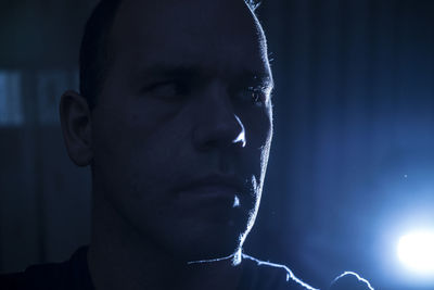 Close-up of man in darkroom