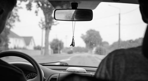 Close-up of eyeglasses on car windshield