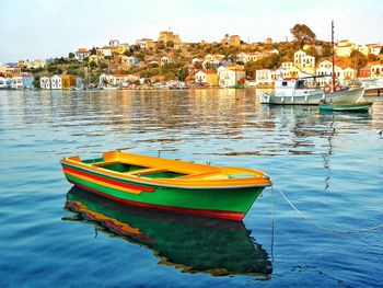 Boats moored at harbor