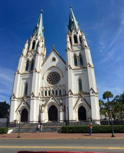 Low angle view of church against blue sky