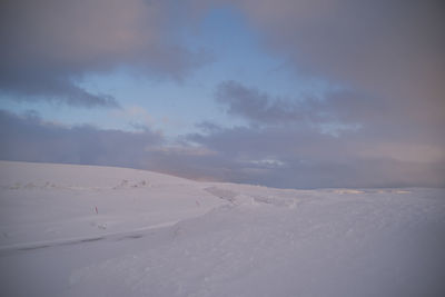 Scenic view of desert against sky during winter