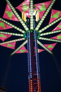 Low angle view of illuminated ferris wheel