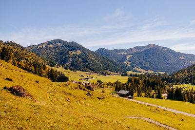 Scenic view of landscape and mountains against sky