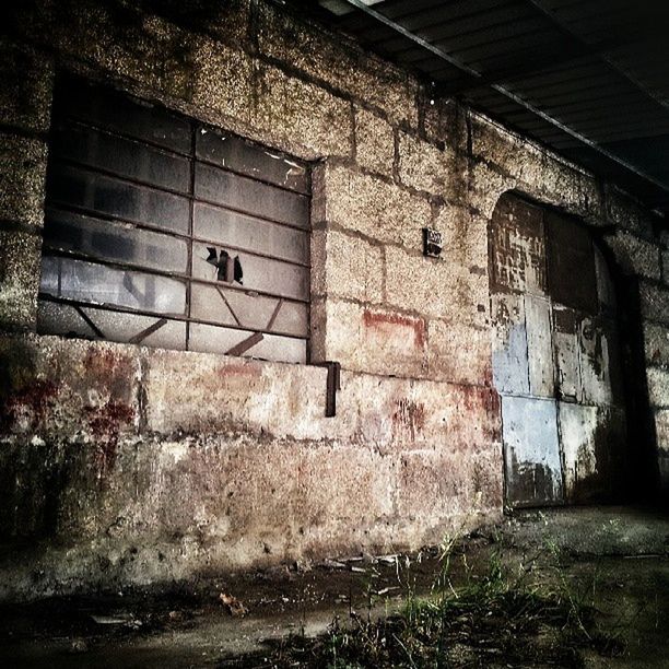 architecture, built structure, abandoned, wall - building feature, text, damaged, graffiti, obsolete, brick wall, old, deterioration, run-down, weathered, wall, communication, western script, building exterior, indoors, no people, building