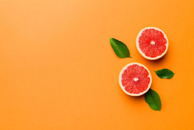 Directly above shot of fruits on yellow background