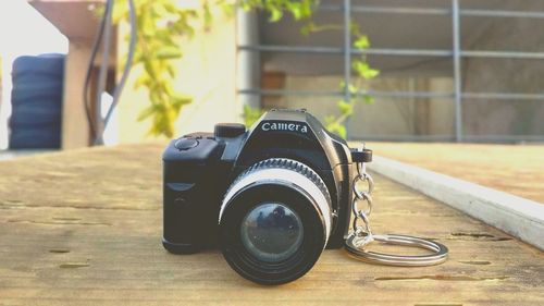 Close-up of camera on table