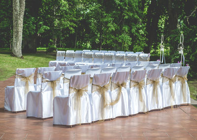 Arrangement of empty wedding chairs outdoors