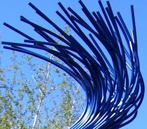 Low angle view of tree against blue sky