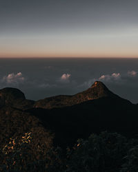 Scenic view of mountains against sky during sunset