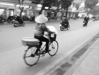 Man riding bicycle on street