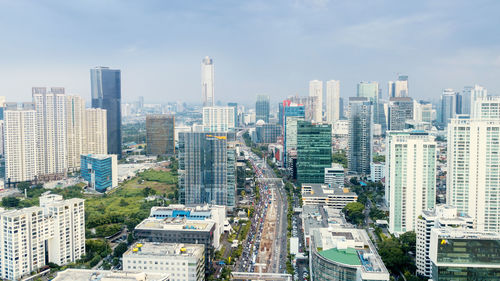 High angle view of buildings in city against sky