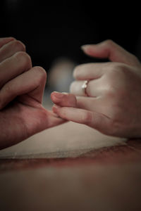 Close-up of people holding hands