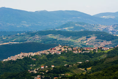 High angle view of townscape and mountains