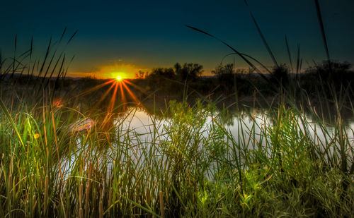 Scenic view of sunset over river
