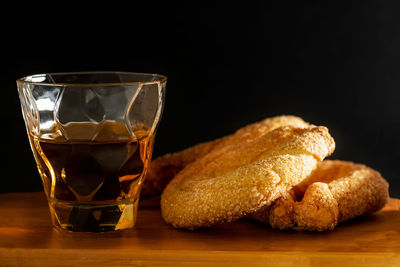 Close-up of breakfast on table against black background