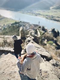 Rear view of woman on rock