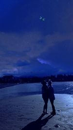 Full length of woman standing on beach