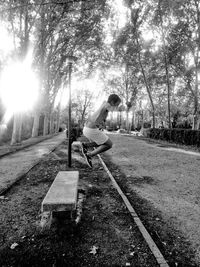 Man sitting on road in park