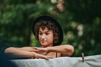 Portrait of teenage girl sitting outdoors