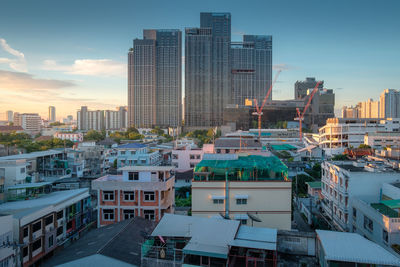 Modern buildings in city against sky