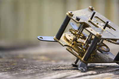 Close-up of machine part on table