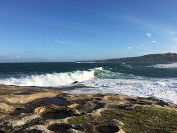 Scenic view of sea against blue sky