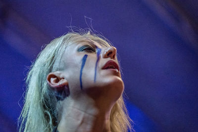 Low angle view of woman looking up