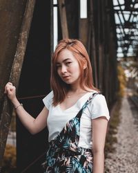 Beautiful young woman standing outdoors