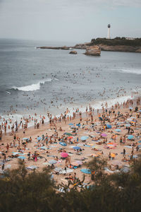 High angle view of people on beach against sky