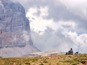 Scenic view of mountains against cloudy sky