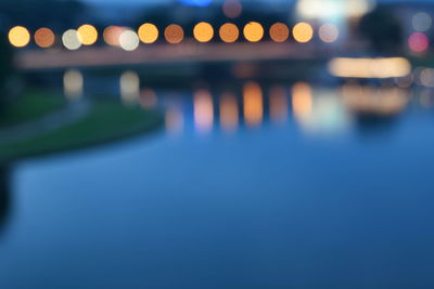 Defocused image of illuminated city at night