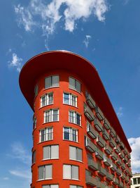 Low angle view of red building against sky