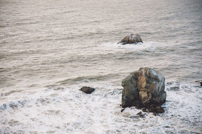 High angle view of stack rocks in sea