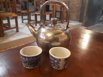 Close-up of tea cup on table at home