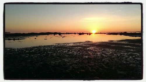 Scenic view of sunset over sea