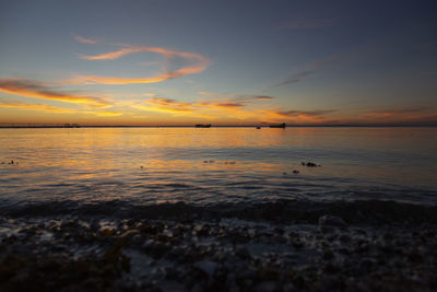 Scenic view of sea against sky during sunset