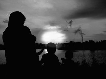 Silhouette of mother with children