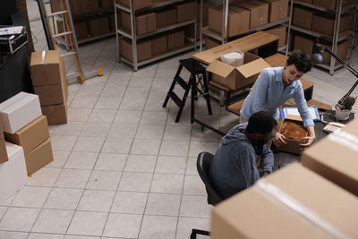 High angle view of people sitting on floor