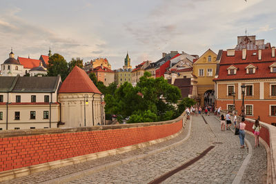 Buildings in town against sky