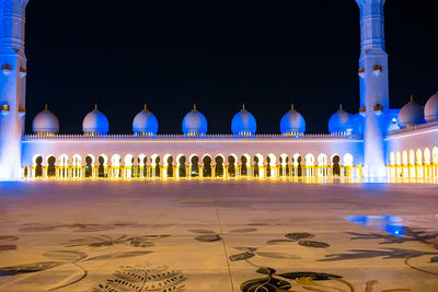 View of illuminated building against clear sky at night