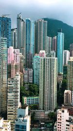 High angle view of buildings in city against sky